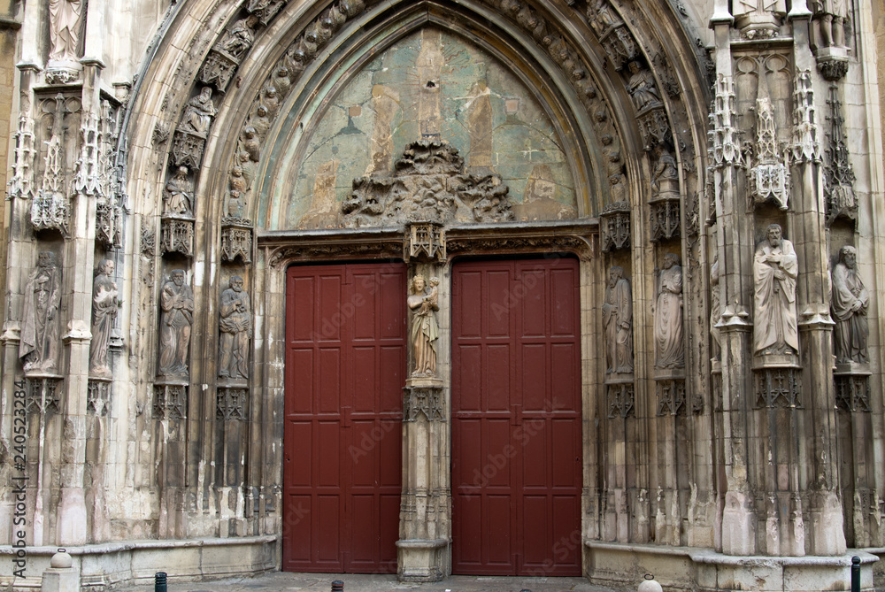 Front view of Aix Cathedral entrance with sculptures
