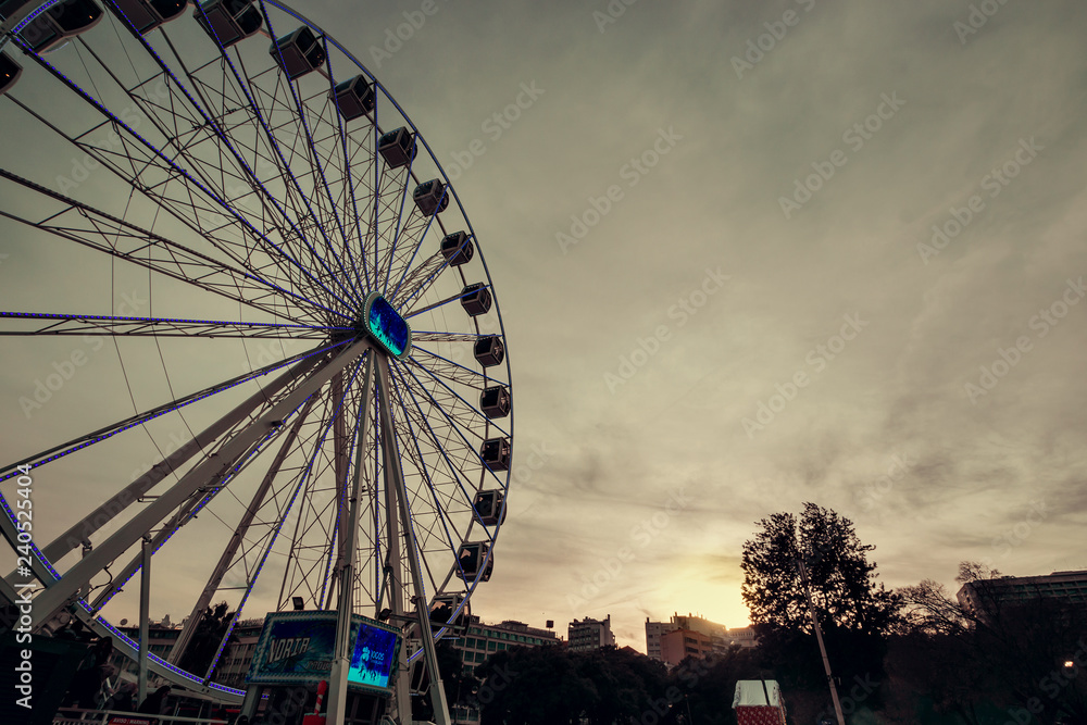 Ferris wheel in Lisbon at dusk, Portugal