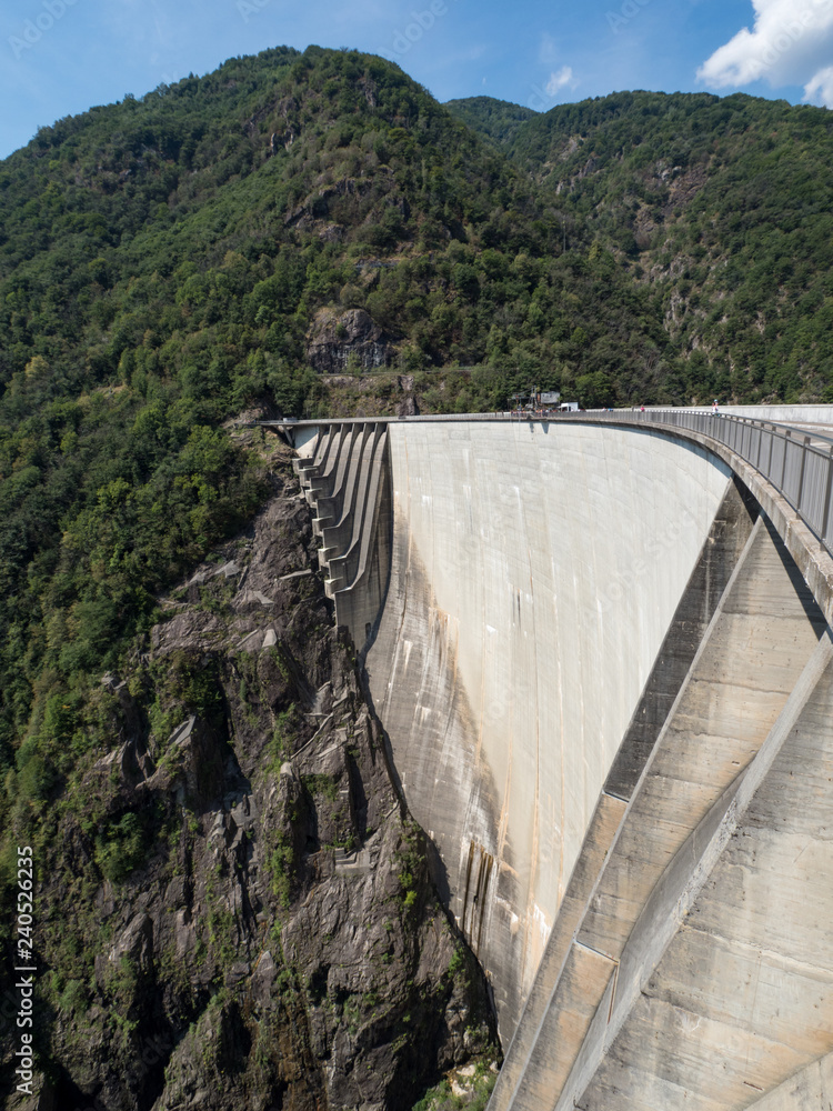 Amazing dam of Contra Verzasca Ticino, Switzerland. The dam creates a water reservoir Lago di Vogorno. Place for bungee jumping and where some scenes of James Bond movie was taken place. August, 2018