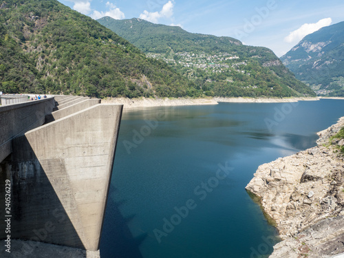 Fototapeta Naklejka Na Ścianę i Meble -  Amazing dam of Contra Verzasca Ticino, Switzerland. The dam creates a water reservoir Lago di Vogorno. Place for bungee jumping and where some scenes of James Bond movie was taken place. August, 2018