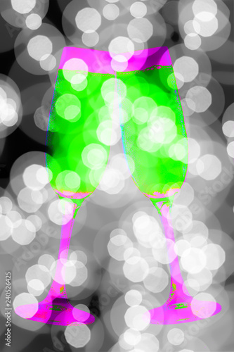 Pink and green champagne glasses with abstract black and white background.