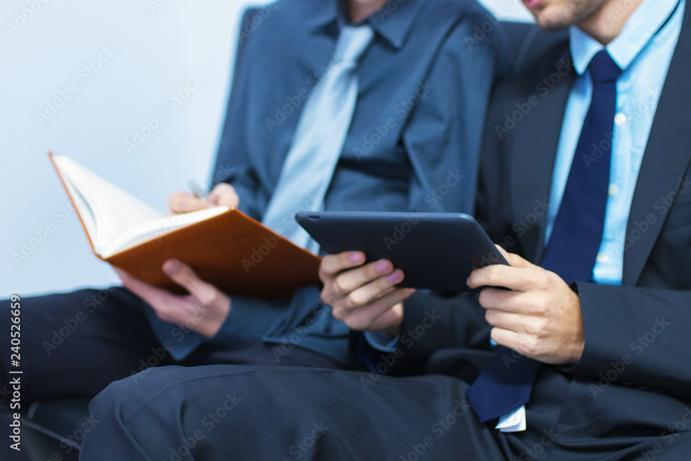 business man with tablet or laptop and book business man with tablet or laptop and book