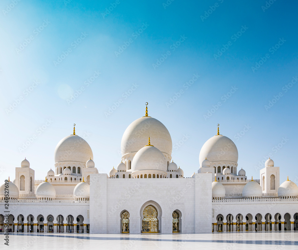Islamic Sheikh Zayed Grand Mosque in Abu Dhabi with domes and symmetry