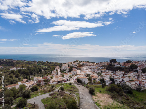 Panorama aerial view of white color houses and Mediterranean architecture in Nerja, Malaga Province, Andalusia, Spain. March, 2018