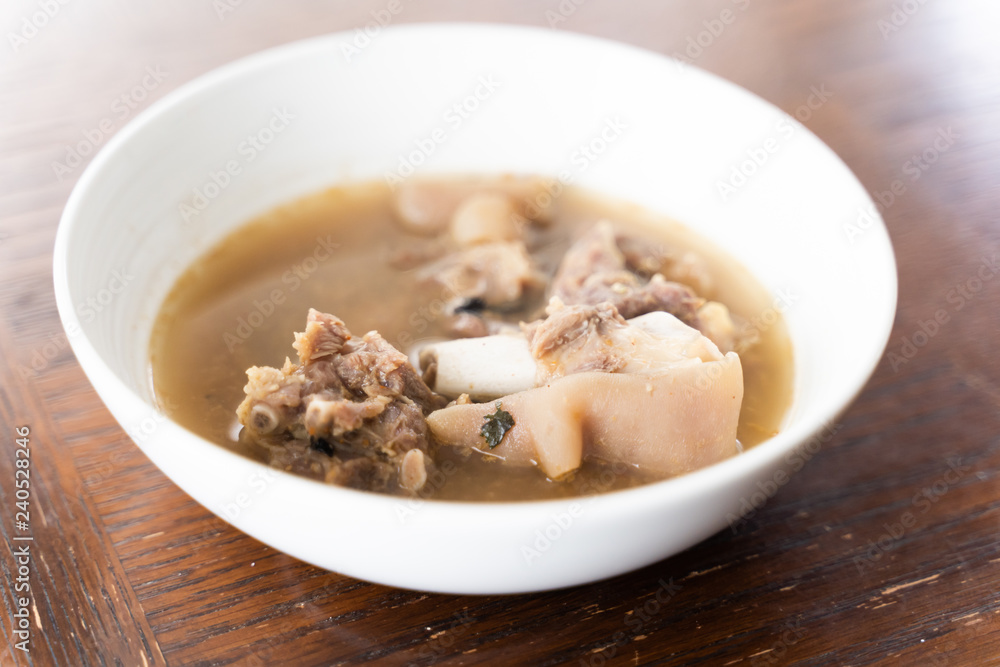 Nigerian Goat Meat Pepper soup served in a white bowl Nigerian Goat Meat Pepper soup served in a white bowl