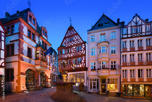 The medieval market square of Bernkastel-Kues, Germany, at dusk. The twin town of Bernkastel-Kues is regarded as the most popular town and center of the Middle Moselle.