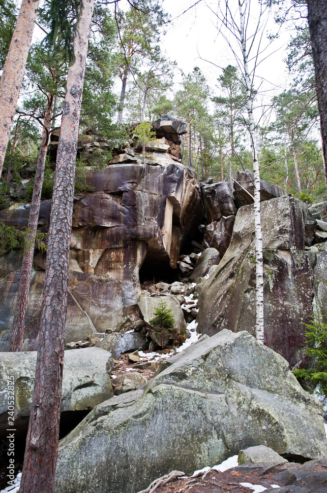 Obraz premium Dovbush rocks in green forest at Carpathian mountains.