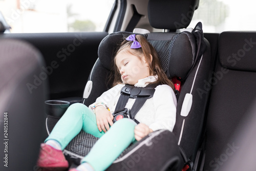 Girl Secured With Seat Belts Resting In Car