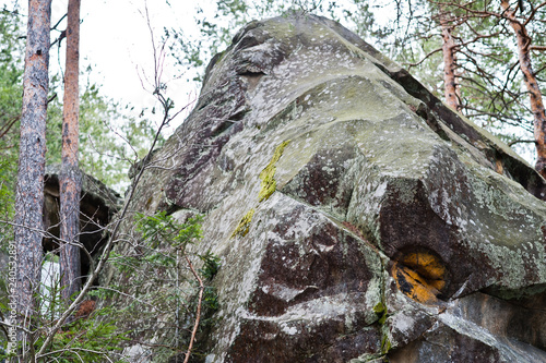 Dovbush rocks in green forest at Carpathian mountains. photo