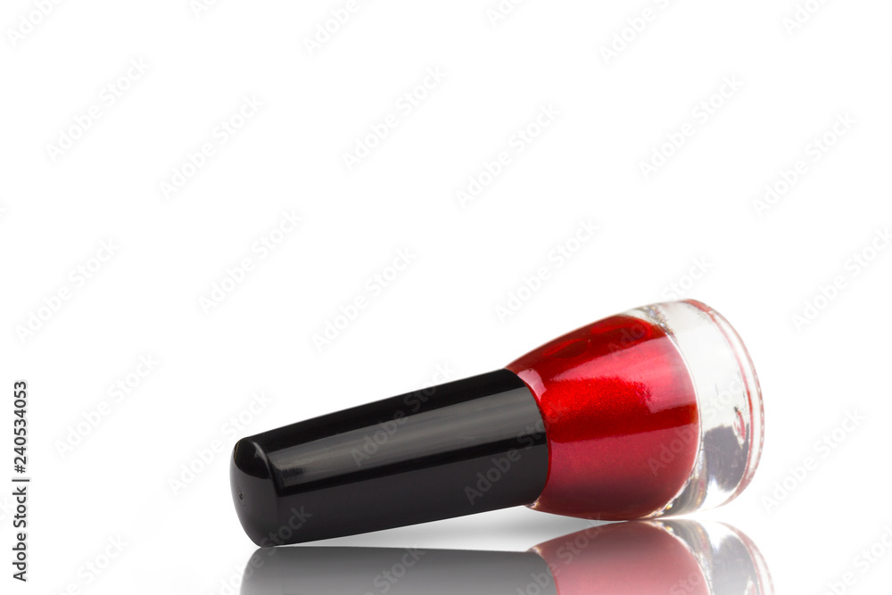 bottle of red lacquer isolate on white background, with mirror surface reflection bottle of red lacquer isolate on white background, with mirror surface reflection