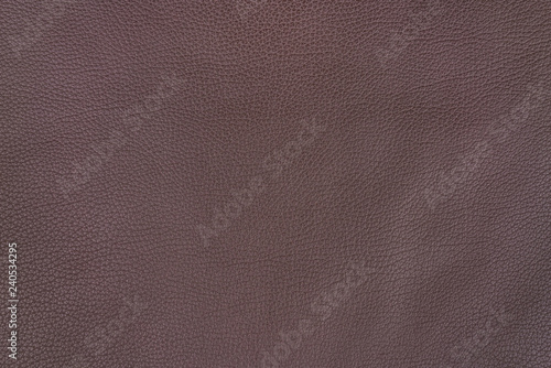 Dark brown leather as a background.