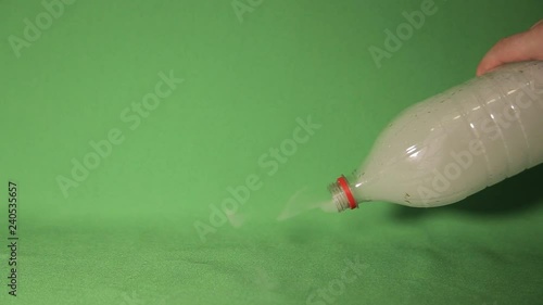 Smoke marijuana, smoke in a bottle, green background, chroma key  photo