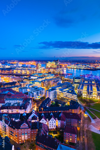 Aerial view of the Harbor District and downtown Hamburg  Germany  at dusk .