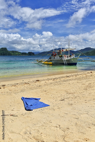 Cudugnon beach with white Filipino bangka-tour boat moored. El Nido-Palawan-Philippines-0885 photo