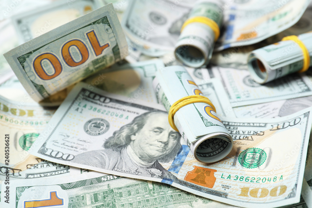 Fototapeta premium Many dollar banknotes as background. National American currency