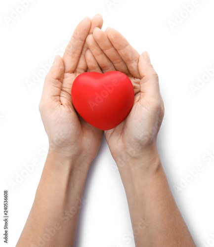 Woman holding red heart on white background, top view. Cardiology concept