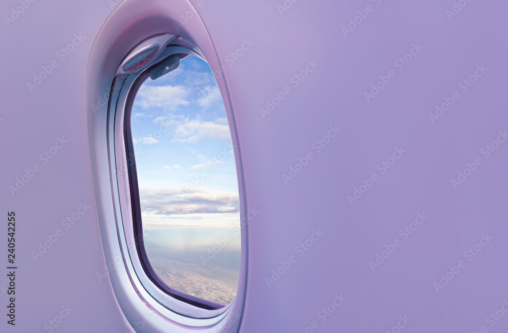 Airplane window with clouds. Background on the theme of tourism and travel.
