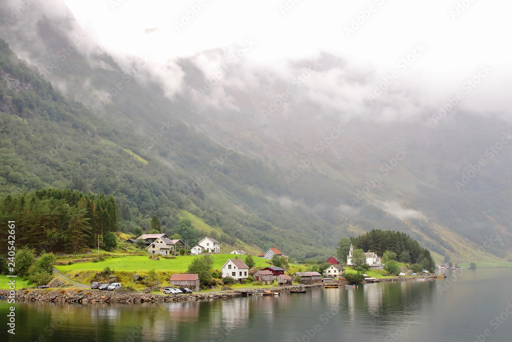 Main view of Bakka, a tiny village in the municipality of Aurland in Sogn og Fjordane county, Norway. It is located on the western shore of the Naeroyfjord  5 kilometres north of Gudvangen village.