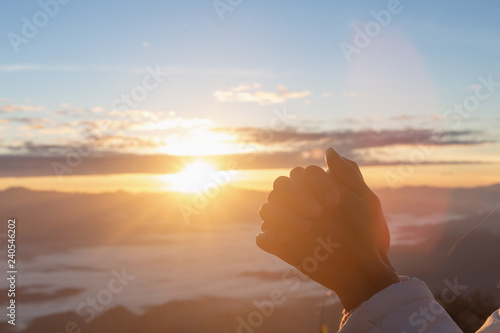 Canvas-taulu Christian woman  hands praying to god on the mountain background with morning sunrise