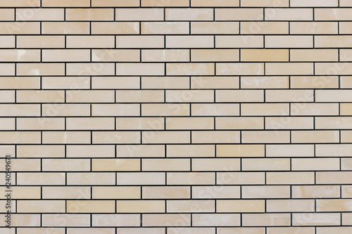 Texture and background of beige brick wall. Seamless texture. Grunge background with space for text or image.