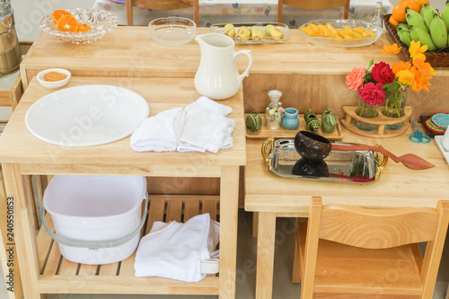 white sink with dish and kitchenware