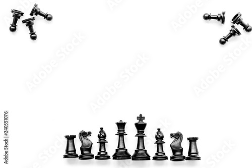 Competition or victory or strategy concept. Chess figures on white background top view pattern copy space