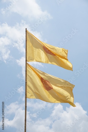buddhist yellow flag on blue sky