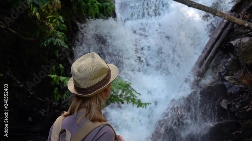 Female Tourist Visiting Siribhume Waterfall in Doi Inthanon National Park in Chiang Mai, Thailand photo