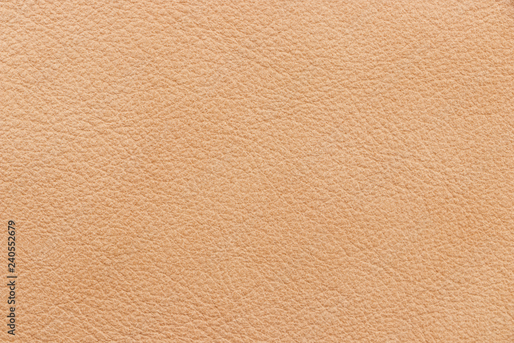 Fototapeta premium The texture of genuine leather beige colour. Material of animal origin. Close-up.