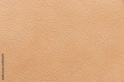 The texture of genuine leather beige colour. Material of animal origin. Close-up.