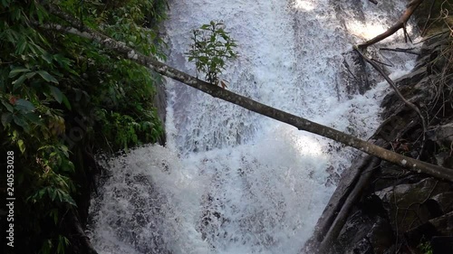 Female Tourist Visiting Siribhume Waterfall in Doi Inthanon National Park in Chiang Mai, Thailand photo