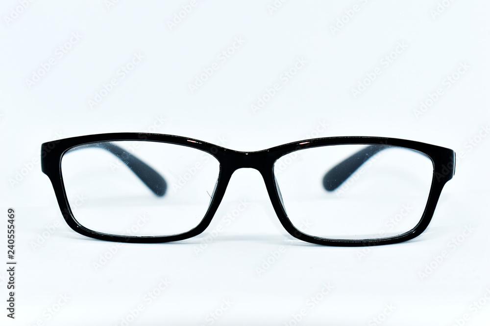 Eye glasses with black frames are arranged on a white background. Eye glasses with black frames are arranged on a white background.