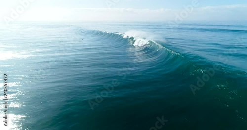 Wallpaper Mural Slow motion aerial view of large blue ocean waves crashing on sunny day  Torontodigital.ca