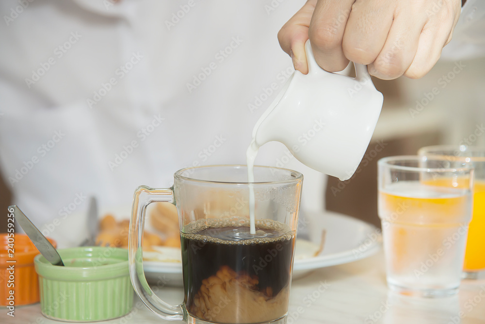 Business man eat the American breakfast set in a hotel - people take a breakfast in hotel concept Business man eat the American breakfast set in a hotel - people take a breakfast in hotel concept