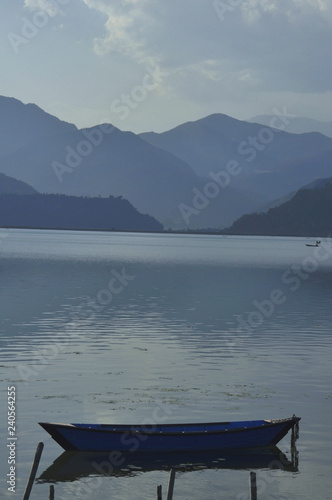 Lake Phewa and the surrounding foothills, a landscape in blue tones.