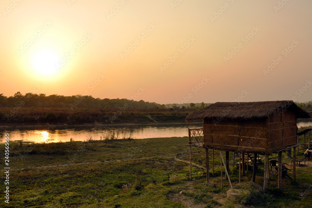 Sunset on the river.The village of Sauraha on the border of Nepal and India