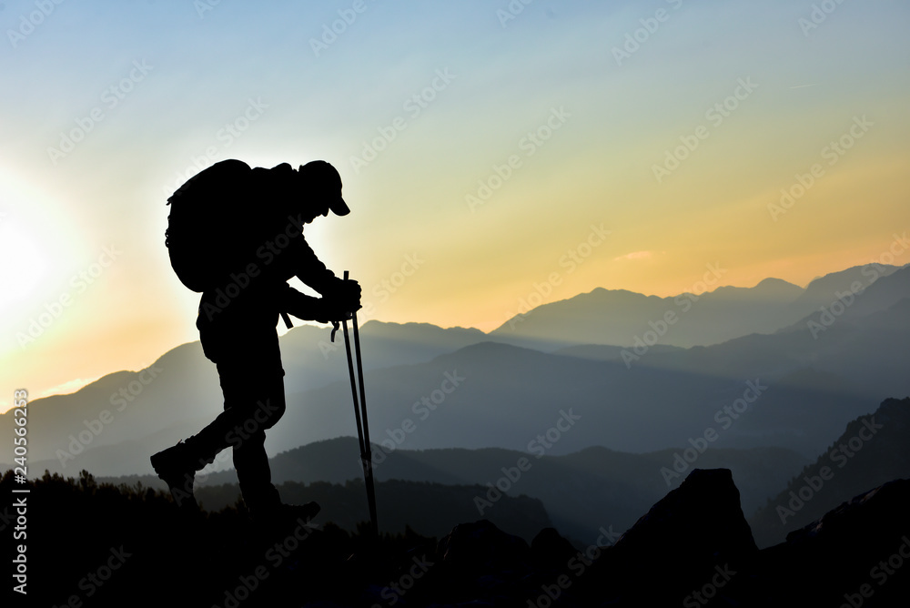 climber hiking in the magnificent mountains