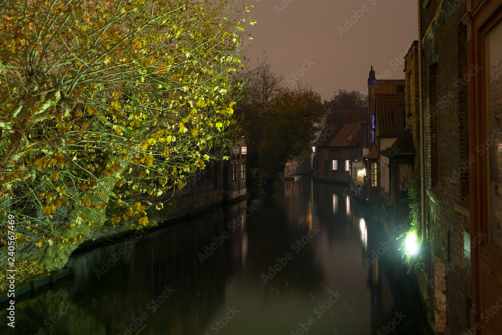 BRUGES BELGIUM ON NOVEMBER 24, 2018: Cityscape by night in the medieval city BRUGES BELGIUM ON NOVEMBER 24, 2018: Cityscape by night in the medieval city