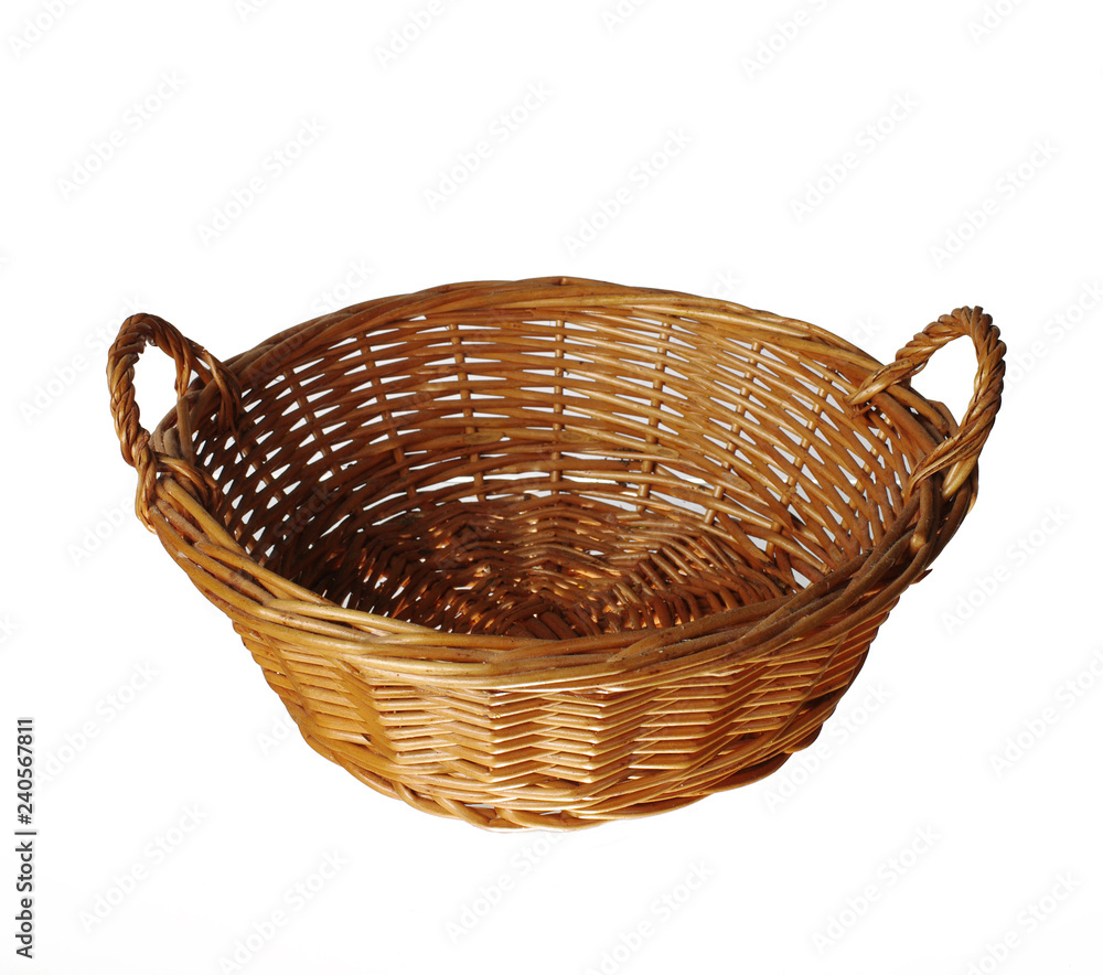 Fototapeta premium Empty wicker basket. Isolated on white