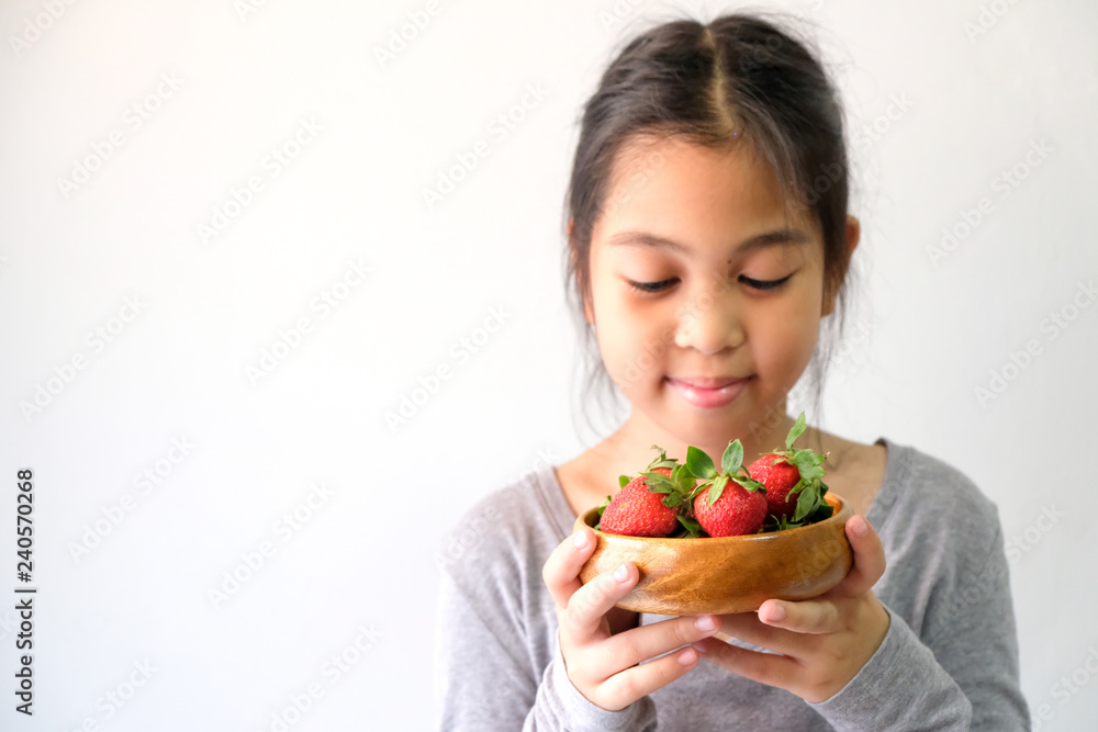 Girls with fresh red strawberries, healthy food Girls with fresh red strawberries, healthy food