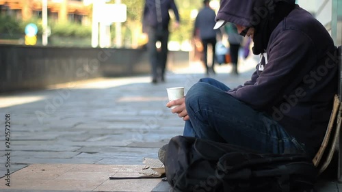 Homeless beggar man begging on the street