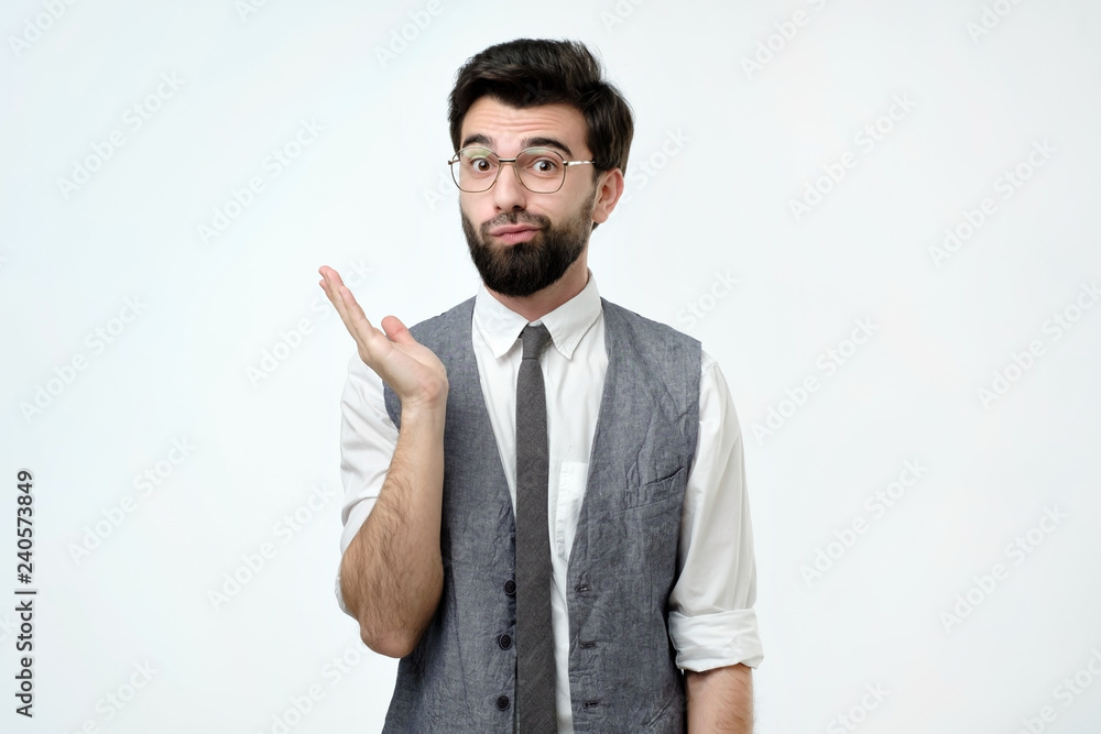 Doubtful bearded young spanish man looking with mistrust. Negative human emotion Doubtful bearded young spanish man looking with mistrust. Negative human emotion