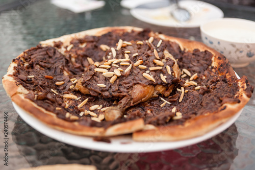 A Palestinian dish called musakhan served at a cafe in old Dubai, United Arab Emirates. © Glen