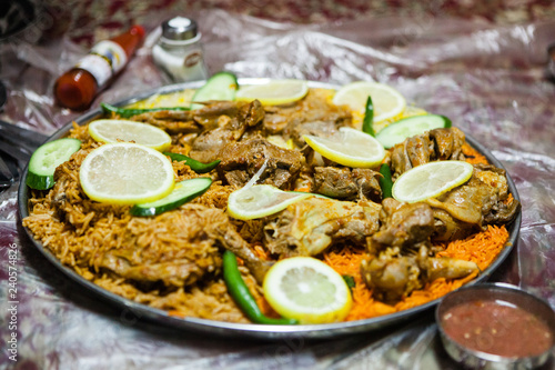 Lamb salona and chicken mandi served on the floor at an Emirati restaurant in Dubai, United Arab Emirates