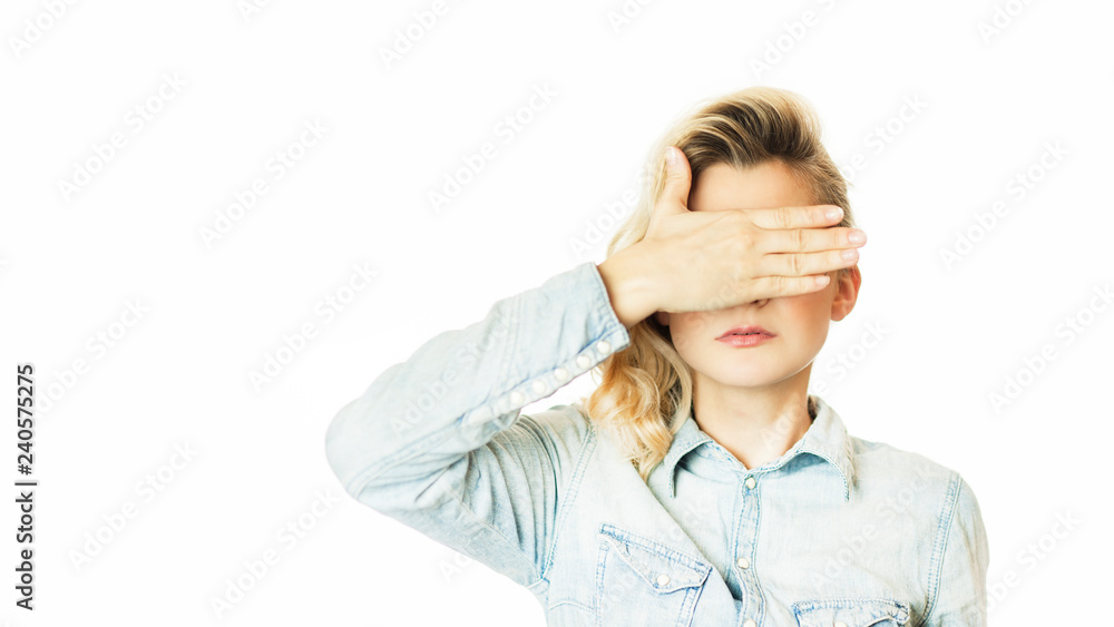 Beautiful young emotional girl closes her eyes to an isolated white background. Do not want to see Beautiful young emotional girl closes her eyes to an isolated white background. Do not want to see