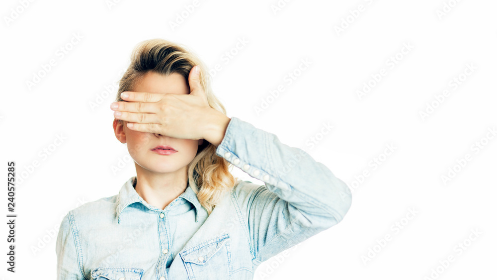 Beautiful young emotional girl closes her eyes to an isolated white background. Do not want to see Beautiful young emotional girl closes her eyes to an isolated white background. Do not want to see