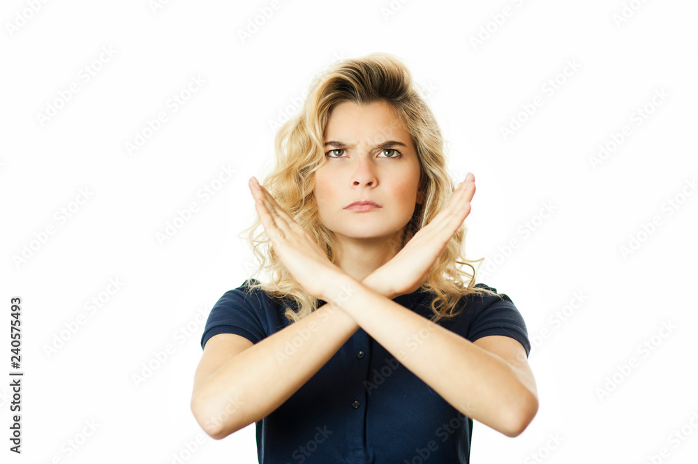 Portrait of a serious woman holding a pair of crossed hands, showing no sign, isolated on a white background. Portrait of a serious woman holding a pair of crossed hands, showing no sign, isolated on a white background.