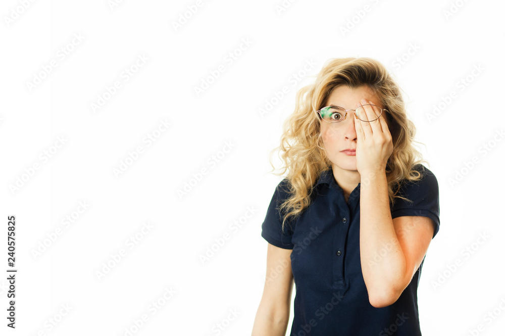 Beautiful young emotional girl closes her eyes to an isolated white background. Do not want to see Beautiful young emotional girl closes her eyes to an isolated white background. Do not want to see