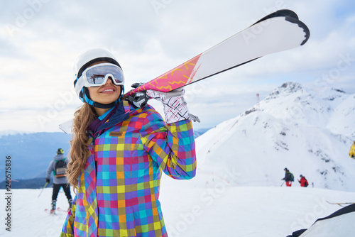 Happy Young Woman Skier Enjoying Sunny Weather In Alps Stock Photo