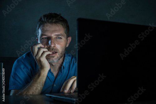 Fotografie young aroused and excited sex addict man watching porn mobile online in laptop c